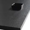 A close-up shot of a black, textured surface, possibly a tabletop or furniture, with a small black square bowl placed on it. Produktbild-Vorschau
