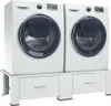 Two white washing machines are stacked on white drawers, shown from the front. Produktbild-Vorschau