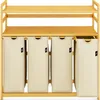 A wooden shelf unit with four beige fabric laundry bins. Anteprima dell’immagine prodotto