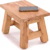 A small wooden stool with a smartphone on top, isolated on a white background. Produktbild-Vorschau