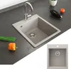 A beige kitchen sink with a faucet, placed on a dark countertop with some vegetables nearby. A smaller inset image shows the sink from a top-down view. Náhled obrázku produktu