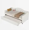A white daybed with a pull-out trundle bed, shown with decorative pillows and a blanket. Produktbild-Vorschau