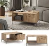 A living room scene with a coffee table, sofa, plant, and rug. Produktbild-Vorschau