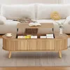 A wooden coffee table with a lift-top mechanism is shown in a living room setting, placed on a rug in front of a white sofa. Podgląd zdjęcia produktu