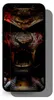 A smartphone with a screen protector featuring a dark, menacing samurai mask design. Produktbild-Vorschau