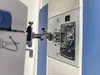A close-up view of a sewing machine's bobbin area and needle mechanism. Náhľad obrázku produktu