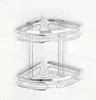 A chrome-plated corner shelf unit with two tiers, mounted on a white tiled wall. Produktbild-Vorschau