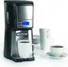A coffee maker with cups and saucers on a white background. Produktbild-Vorschau