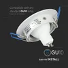 A white GU10 lamp holder with blue clips and a label, shown from a diagonal angle against a black background. Náhled obrázku produktu