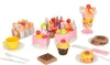 A collection of toy birthday cake slices, cupcakes, and a drink, along with cutlery and a knife, arranged on a white background. Podgląd zdjęcia produktu