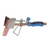 A soldering iron with a copper tip, brass fittings, and a blue and black handle, isolated on a white background. Náhľad obrázku produktu