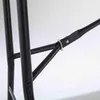 Close-up of the black metal frame of a folding table, showing the hinge mechanism and support bars. Voir les images du produit