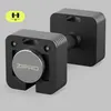 A close-up studio shot of a black adjustable dumbbell with a silver adjustment dial. Produktbild-Vorschau