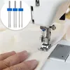 Close-up of sewing needles with a sewing machine in the background. Produktbild-Vorschau