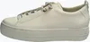 A side view of a white leather sneaker with gold eyelets. Voir les images du produit