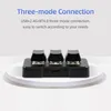 A black three-key mechanical keyboard module with text describing its connection modes. Produktbild-Vorschau