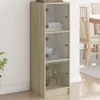 A tall, narrow cabinet with glass doors and wooden shelves, placed against a wall. Anteprima dell’immagine prodotto
