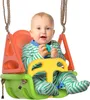 A baby sitting in a colorful swing.