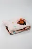 A folded blanket with a Disney character print on a white background. Produktbild-Vorschau