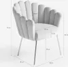 A light gray velvet armchair with silver legs, shown with dimensions indicated by measurement lines and text. Produktbild-Vorschau