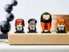 Four LEGO BrickHeadz figures of Harry Potter characters are displayed on a cardboard box. Produktbild-Vorschau