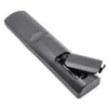 The back of a black remote control with the battery compartment open, showing two AA batteries inserted. Produktbild-Vorschau