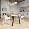 A dining table with chairs in a modern rustic kitchen setting. Produktbild-Vorschau