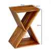A wooden side table with an X-shaped design, with dimensions indicated by red lines and text. Podgląd zdjęcia produktu