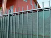 A close-up view of a green privacy screen fence. Podgląd zdjęcia produktu