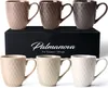 A set of ceramic mugs displayed on a black box with the brand name and product details. Produktbild-Vorschau