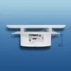 Side view of a white circular electronic device with a white flat top, mounted on a blue background. Produktbild-Vorschau