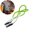 A pair of green jar tongs on a white background, with a circular inset showing the tongs being used to lift a jar. Produktbild-Vorschau