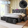 A modern upholstered bed frame with storage drawers, featuring integrated charging ports and cup holders in the headboard. Podgląd zdjęcia produktu