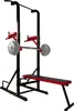 A black and red power tower with a barbell and weights attached, set against a white background. Produktbild-Vorschau