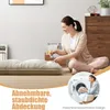A woman is kneeling on the floor next to a floor mattress, and a smaller inset image shows a man loading laundry into a washing machine. Náhľad obrázku produktu