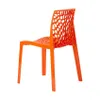 An orange designer chair with a honeycomb-like pattern on the back and seat, shown from a three-quarter rear view against a white background. Produktbild-Vorschau