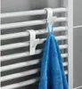 Two white hooks are attached to a white radiator, with a blue towel hanging from one of them. Podgląd zdjęcia produktu