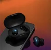 A pair of black wireless earbuds and their charging case are placed on a smartphone. Podgląd zdjęcia produktu