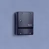 A black Steinel NightMatic 2000 dusk sensor is mounted on a light gray wall. Anteprima dell’immagine prodotto