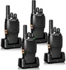Four black walkie-talkies are arranged in a group, each in its own charging dock. Produktbild-Vorschau