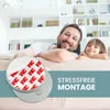 A father and son are relaxing on a couch, with a close-up of a magnetic mount with 3M adhesive tape in the foreground. Anteprima dell’immagine prodotto