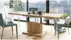 A dining table set up in a modern dining room with a large window overlooking a mountain landscape. Produktbild-Vorschau