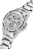 A close-up, angled view of a silver Guess watch with diamond accents. Voir les images du produit