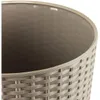 Close-up view of the interior and exterior of a woven-style planter pot. Produktbild-Vorschau