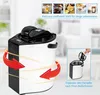 A white and black mini steam sauna with red arrows indicating airflow, and inset images showing ingredients and a person adding water. Náhľad obrázku produktu