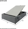 A grey upholstered bed frame with the mattress support lifted to reveal storage space. Dimensions are indicated with measurement lines and numbers. Podgląd zdjęcia produktu