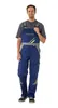 A man wearing blue overalls with yellow and gray accents, standing against a white background. Produktbild-Vorschau