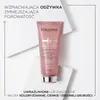 A pink tube of Kerastase hair conditioner is placed on angled white surfaces. Podgląd zdjęcia produktu