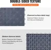 Close-up views of interlocking garage floor tiles, showcasing their double-sided texture and diamond grid pattern. Voir les images du produit