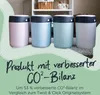Four diaper bins in different pastel colors are displayed in front of a shelf with baskets. Produktbild-Vorschau